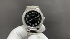 Patek Philippe wristwatch: black dial, silver case, diamond bezel