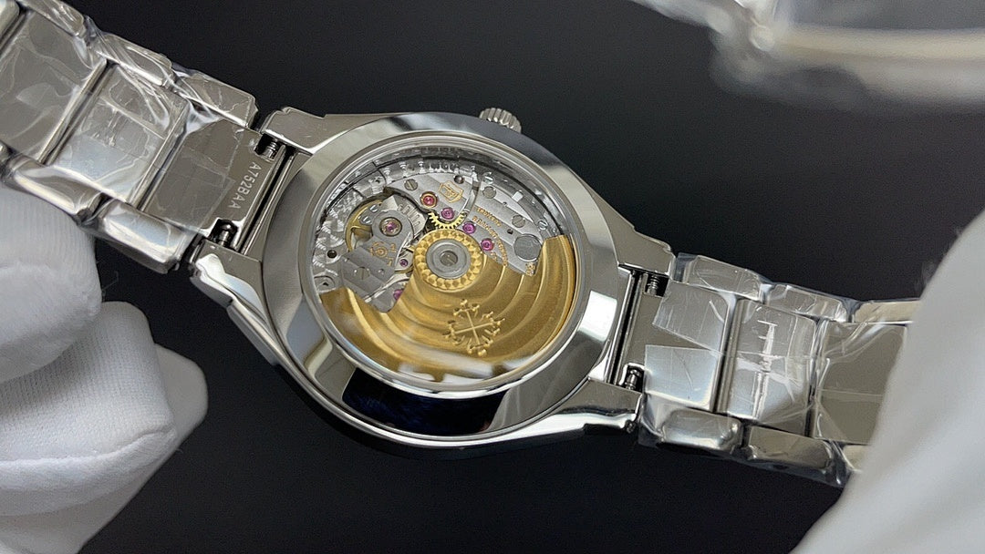 Sapphire caseback view: mechanical movement in round silver watch