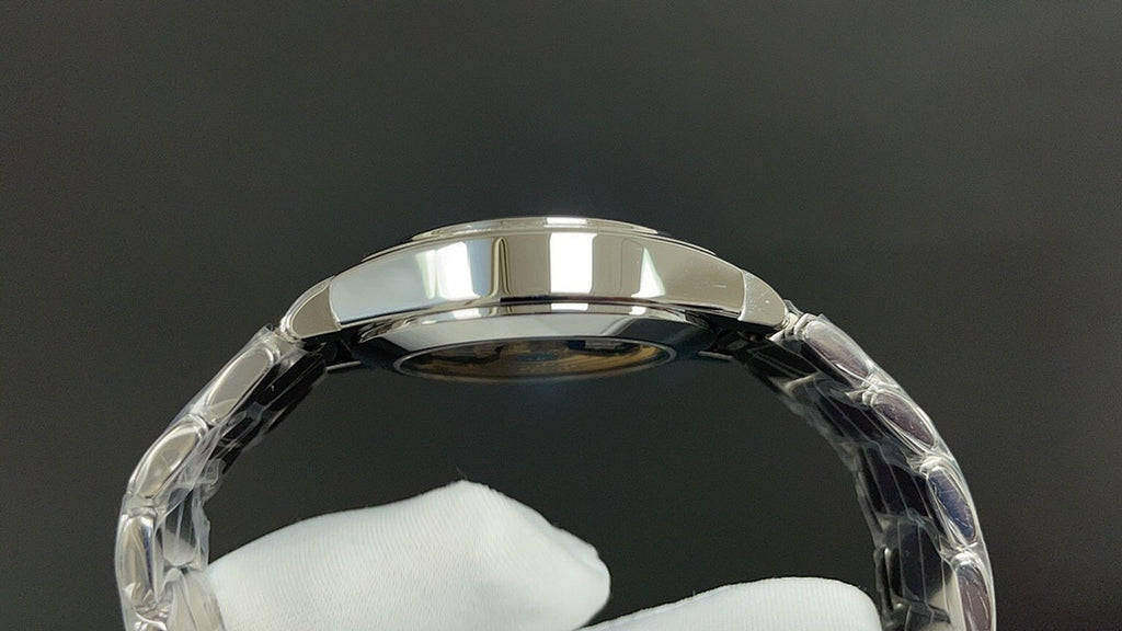 Silver watch caseback with round glass window