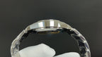 Silver watch caseback with round glass window