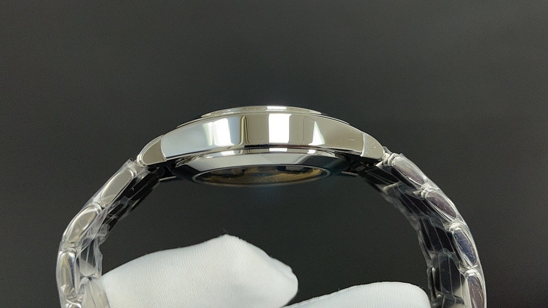 Silver watch caseback with round glass window