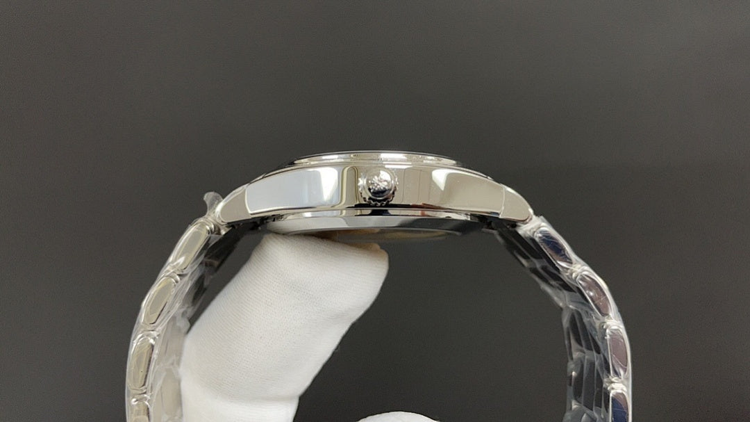 Silver watch caseback with metal rim and glass window