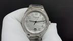 Patek Philippe watch with silver metal bracelet, white dial, diamond-look bezel