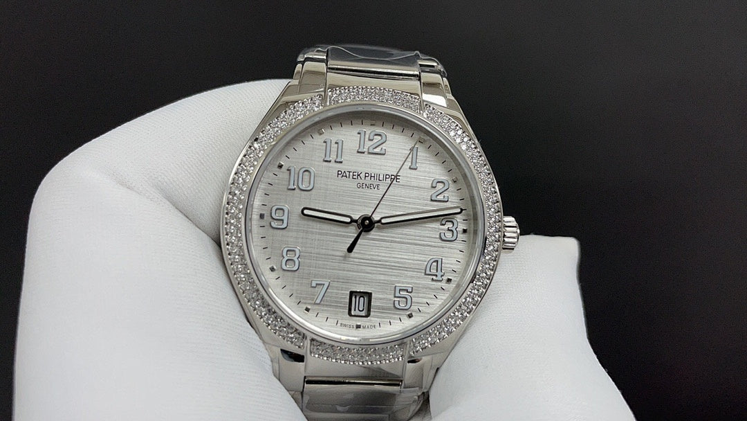 Patek Philippe watch with silver metal bracelet, white dial, diamond-look bezel