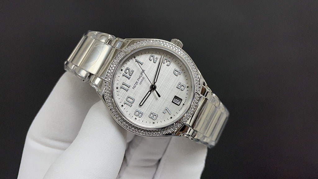 Patek Philippe watch angled view with silver metal bracelet and white dial