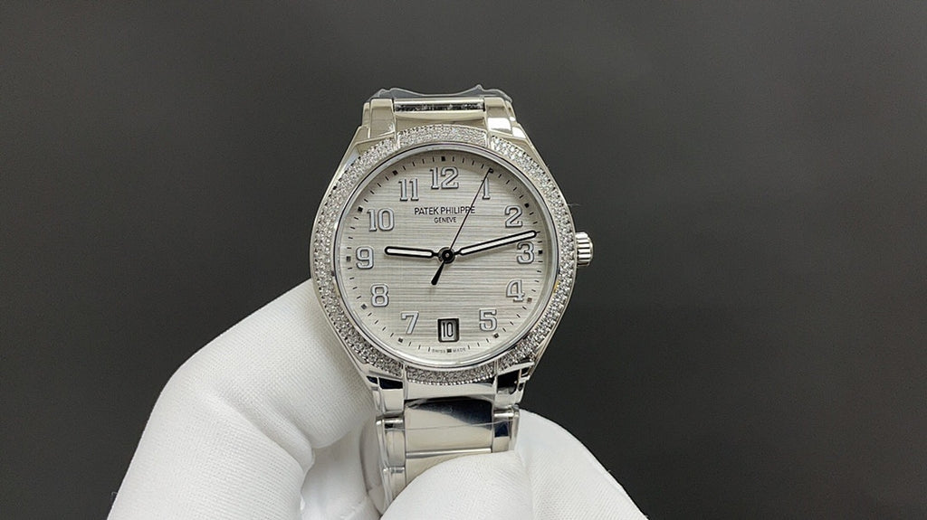 Patek Philippe watch front view with silver bracelet, jeweled bezel, white dial