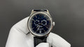 Patek Philippe wristwatch with blue dial and black leather strap