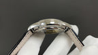 Wristwatch stainless steel case side with crown and black leather strap