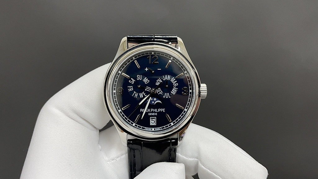 Wristwatch front with blue dial and black leather strap