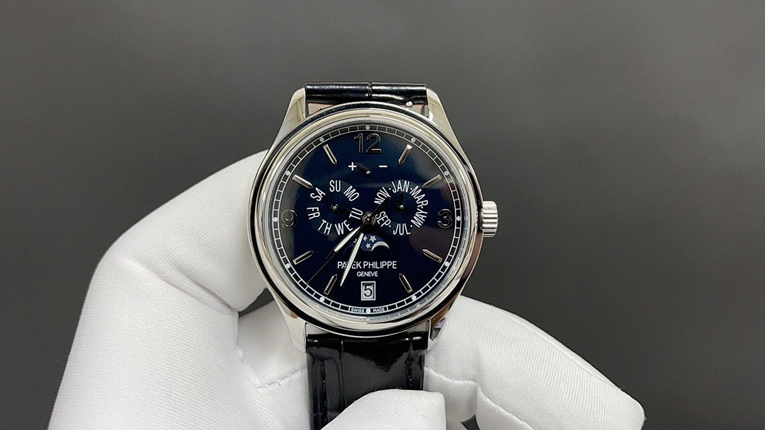 Wristwatch front with blue dial and black leather strap