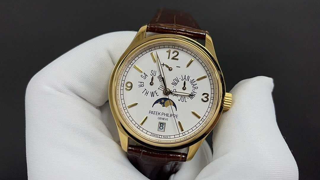 Patek Philippe watch front view, gold case, white dial, and brown leather strap.