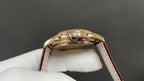 Patek Philippe wristwatch, gold-tone caseback and brown leather strap
