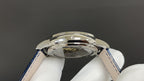 Patek Philippe watch side view with polished case and blue leather strap