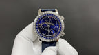 Patek Philippe watch front view with starry blue dial, Roman numerals, and blue strap