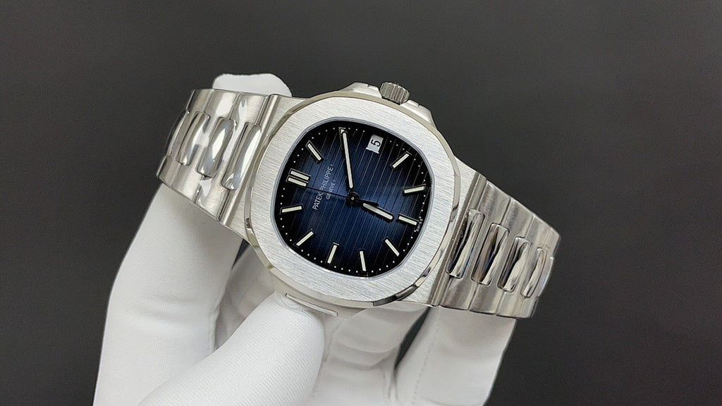 Stainless steel wristwatch with blue dial and metal bracelet from side angle