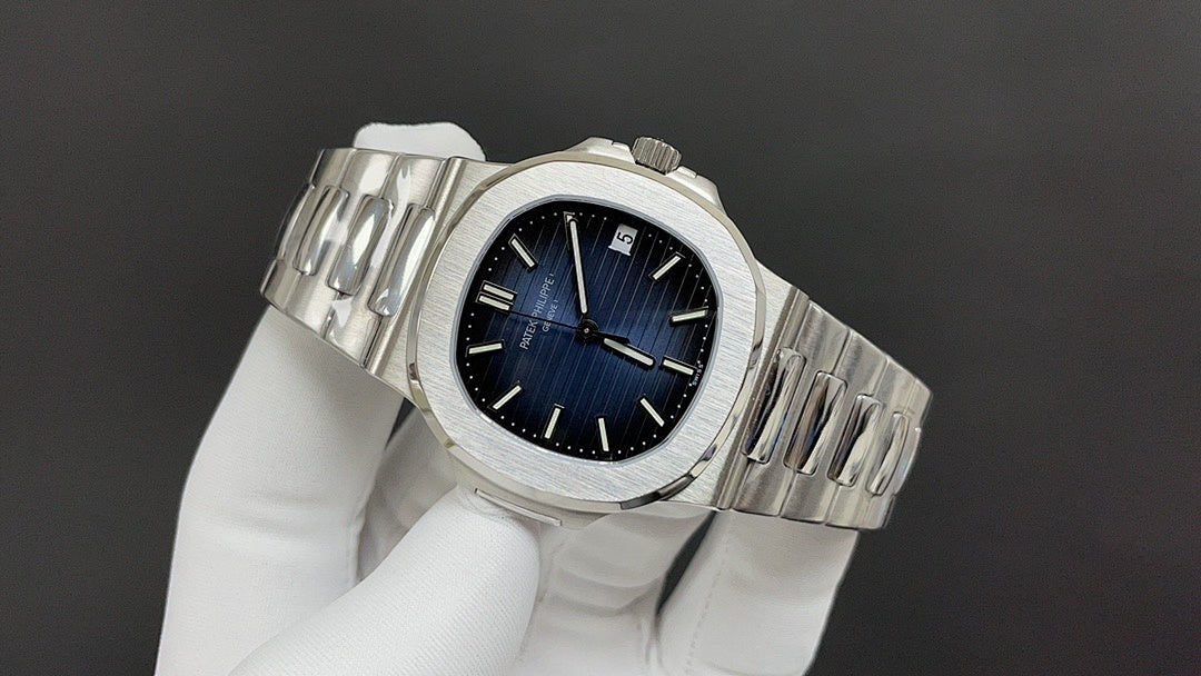 Stainless steel wristwatch with blue dial and metal bracelet from side angle