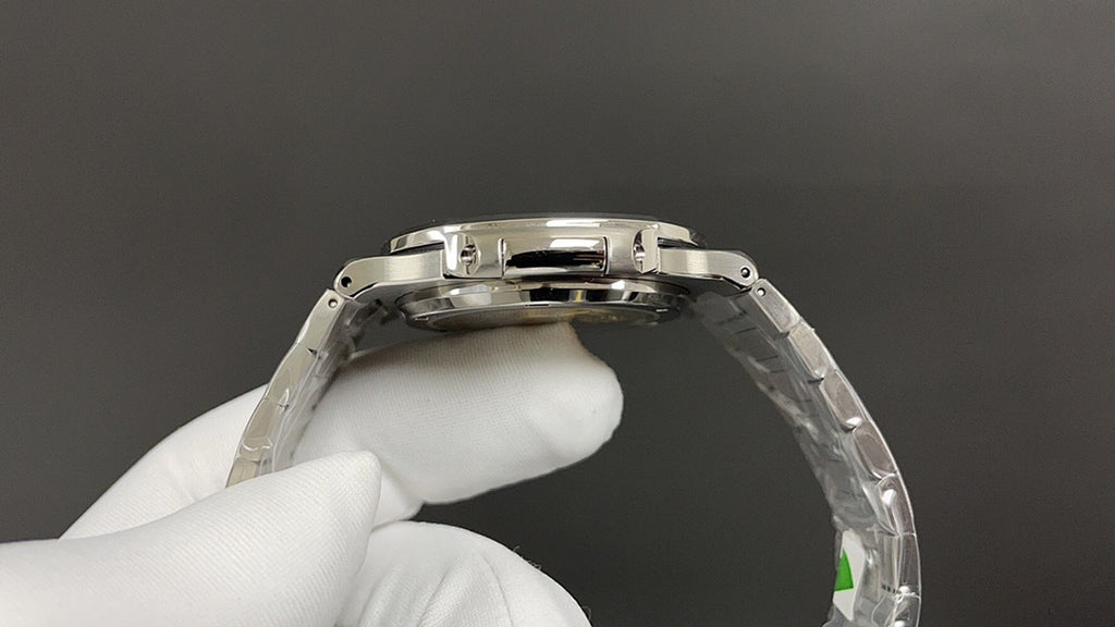 Patek Philippe watch crown and bezel with steel finish, top view