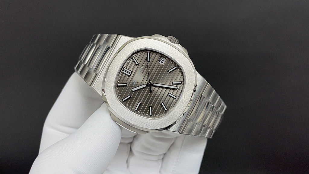 Patek Philippe wristwatch angled view with steel bracelet and sunburst dial