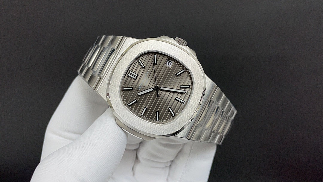 Patek Philippe wristwatch angled view with steel bracelet and sunburst dial