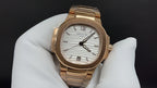 Gold-tone Patek Philippe wristwatch with white dial and baton-style hour markers