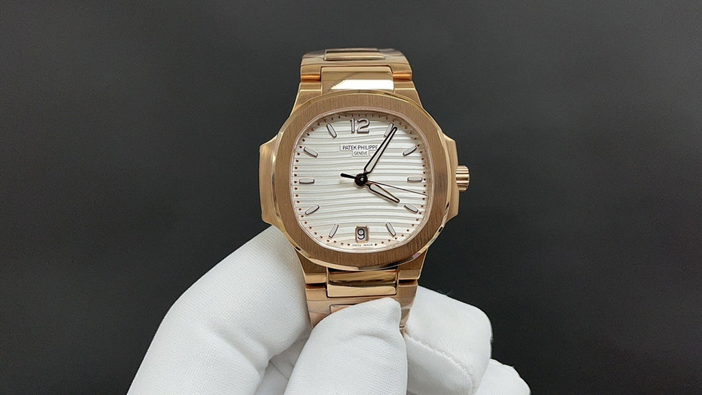 Front view gold-tone Patek Philippe wristwatch with white dial and gold bracelet