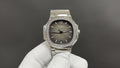 Stainless steel wristwatch with dark dial, jeweled bezel, metal bracelet, round crown