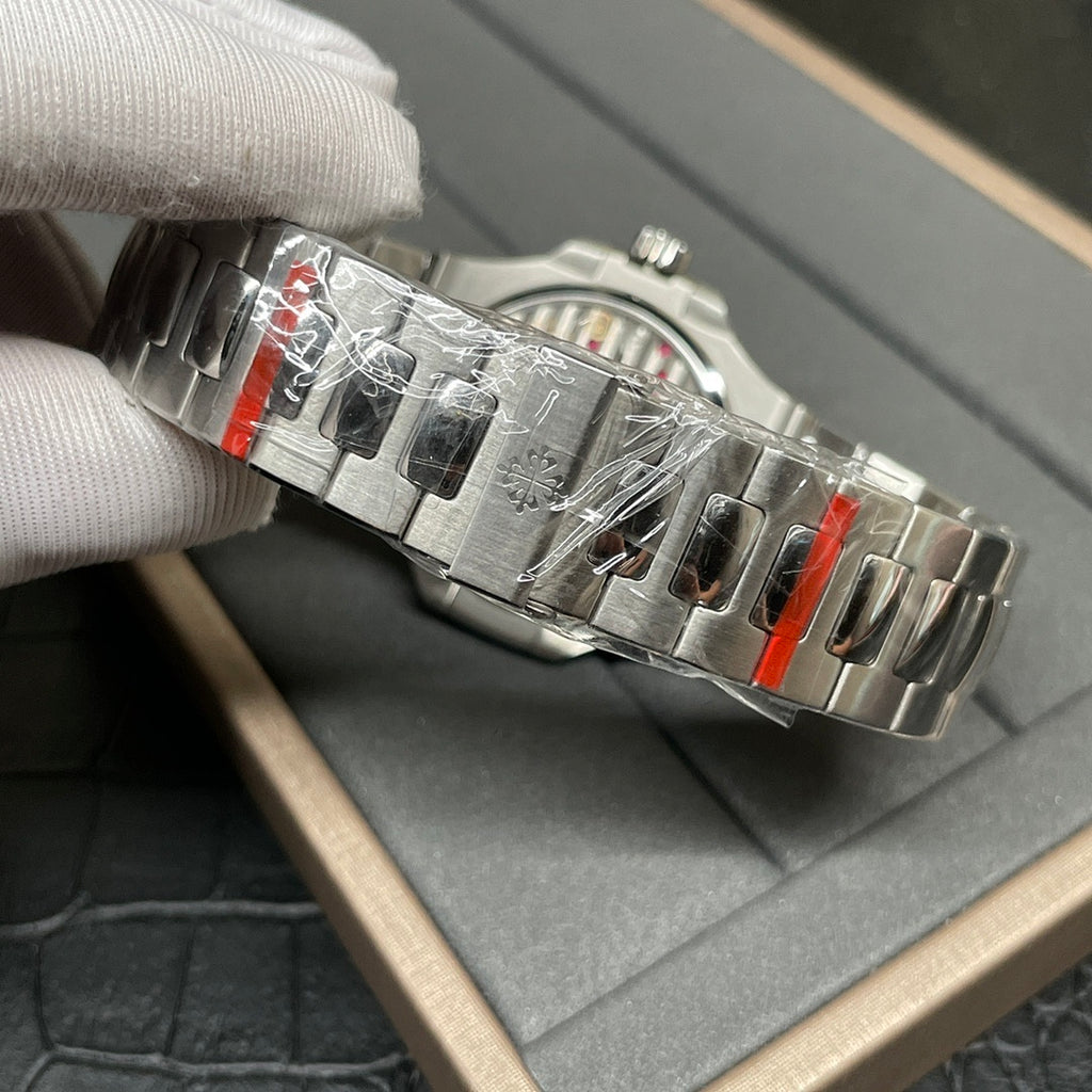 Stainless steel watch bracelet with clasp, showing inner mechanism details