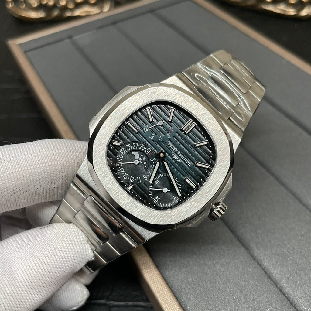 Stainless steel Patek Philippe watch with black dial and teal hour markers