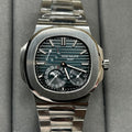 Stainless steel Patek Philippe watch with black dial, teal accents, and subdials