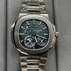 Stainless steel Patek Philippe watch with black dial, teal accents, and subdials