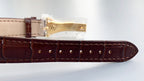 Patek Philippe watch brown leather strap end with metal buckle and riveted rows