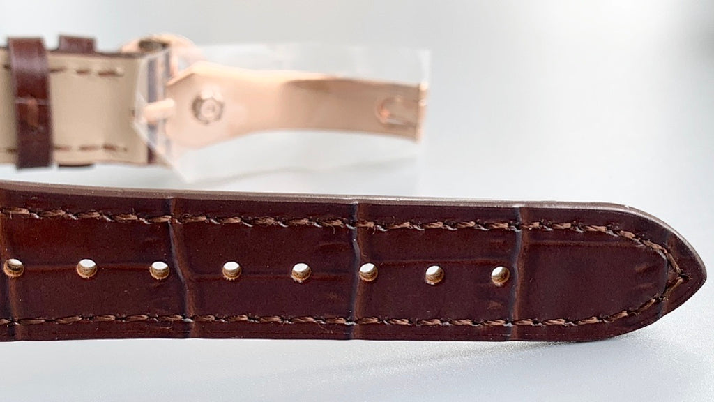 Patek Philippe watch leather strap with stitched edges and punched holes, metal clasp
