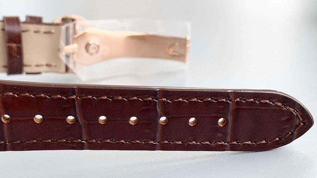 Patek Philippe watch leather strap with stitched edges and punched holes, metal clasp
