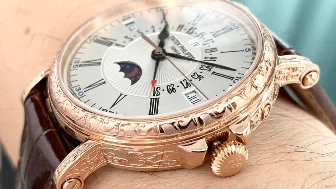 Patek Philippe watch side view with brown leather strap, white dial, and gold-tone crown