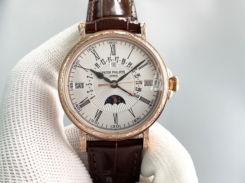 Patek Philippe watch on white cushion with brown leather strap, gold-tone case, and white dial