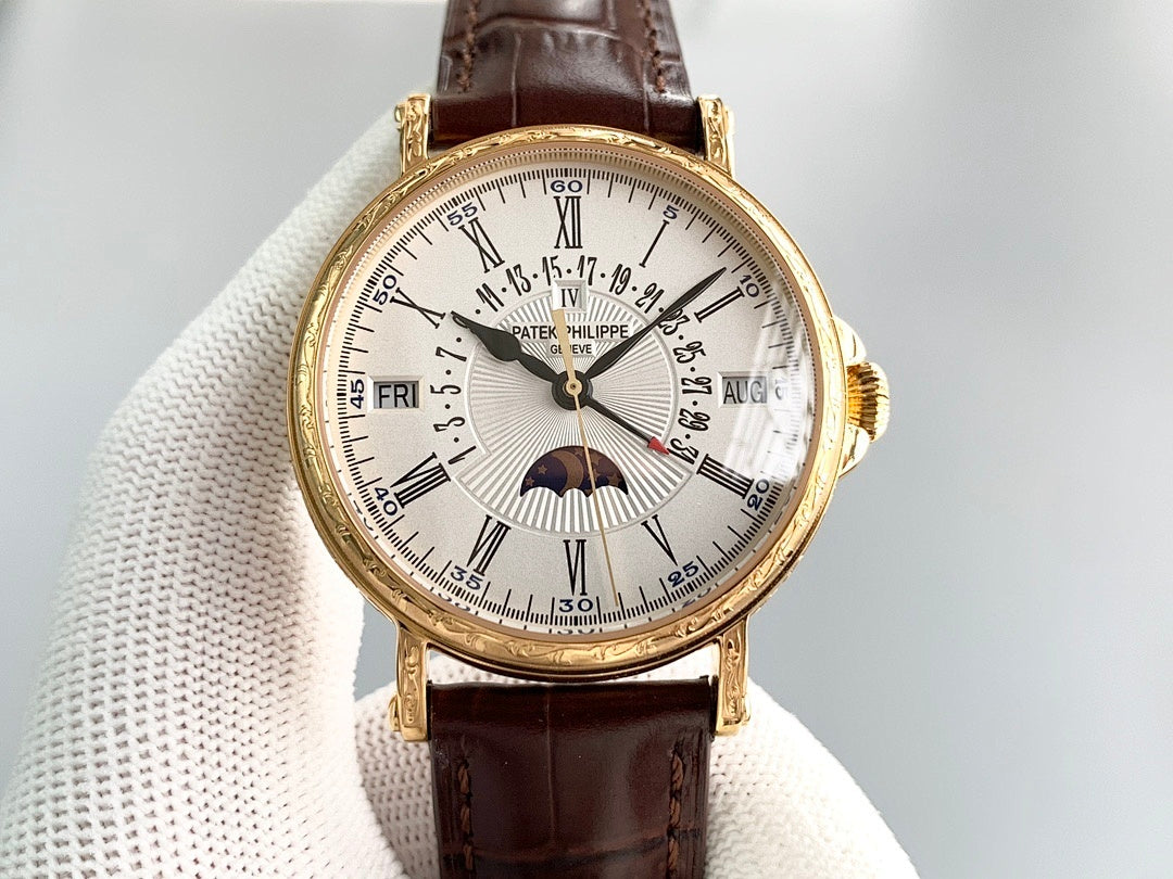 Gold wristwatch with brown leather strap, white dial, Roman numerals and moonphase