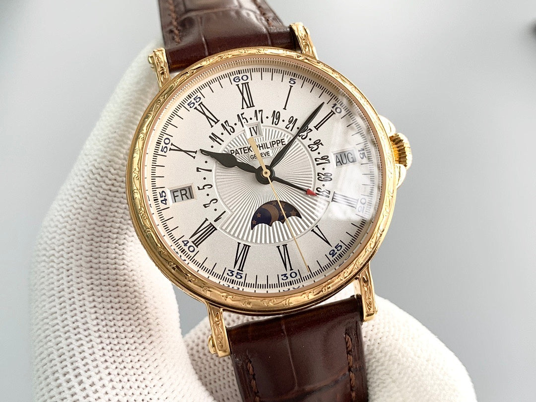 Gold wristwatch with brown leather strap, white dial and visible date markers