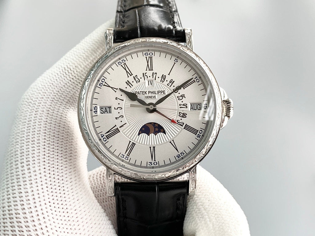 Patek Philippe luxury wristwatch with silver face, Roman numerals, and black leather strap