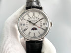 Patek Philippe luxury wristwatch with silver face, Roman numerals, and black leather strap