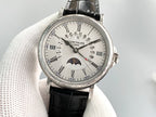 Luxury wristwatch with silver face, Roman numerals, and black leather strap