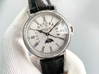 Luxury wristwatch front view with silver dial, black leather strap, and Roman hour markers