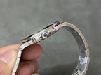 Wristwatch clasp view with metal buckle and engraved hinge detail