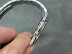Stainless steel wristwatch clasp and strap link close-up