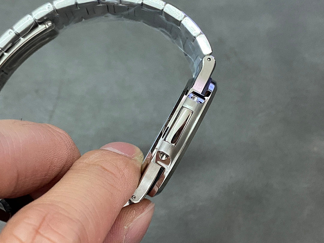 Stainless steel wristwatch clasp and strap link close-up