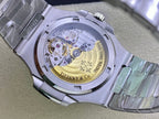 Stainless steel watch caseback with visible mechanical movement and engraved markings