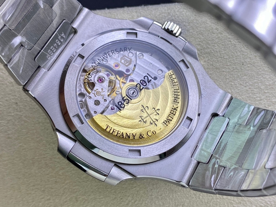 Stainless steel watch caseback with visible mechanical movement and engraved markings