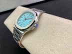 Stainless steel wristwatch with bright blue dial and metal bracelet, angled side view