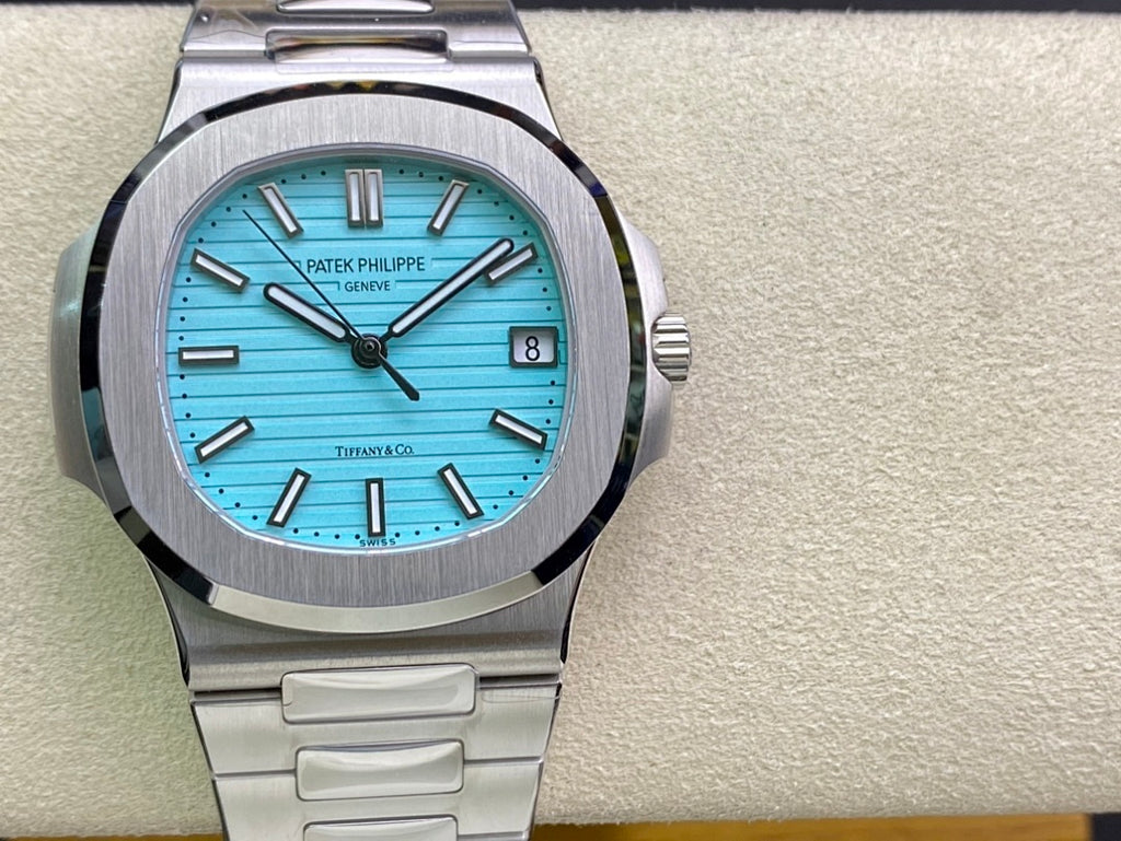 Stainless steel wristwatch with bright blue dial, baton markers, date window, front view
