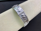 Patek Philippe watch silver metal bracelet, side view with watch case edge
