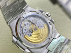 Patek Philippe watch open caseback with visible gold-toned movement and metal bracelet